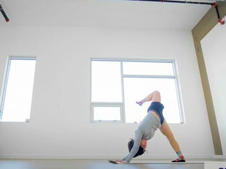 Woman stretching in a room