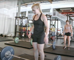 Woman preparing to lift a barbell