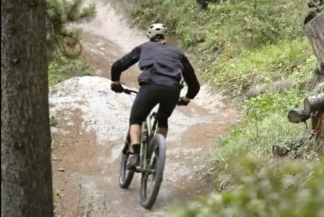 Mountain biker on a wooded trail